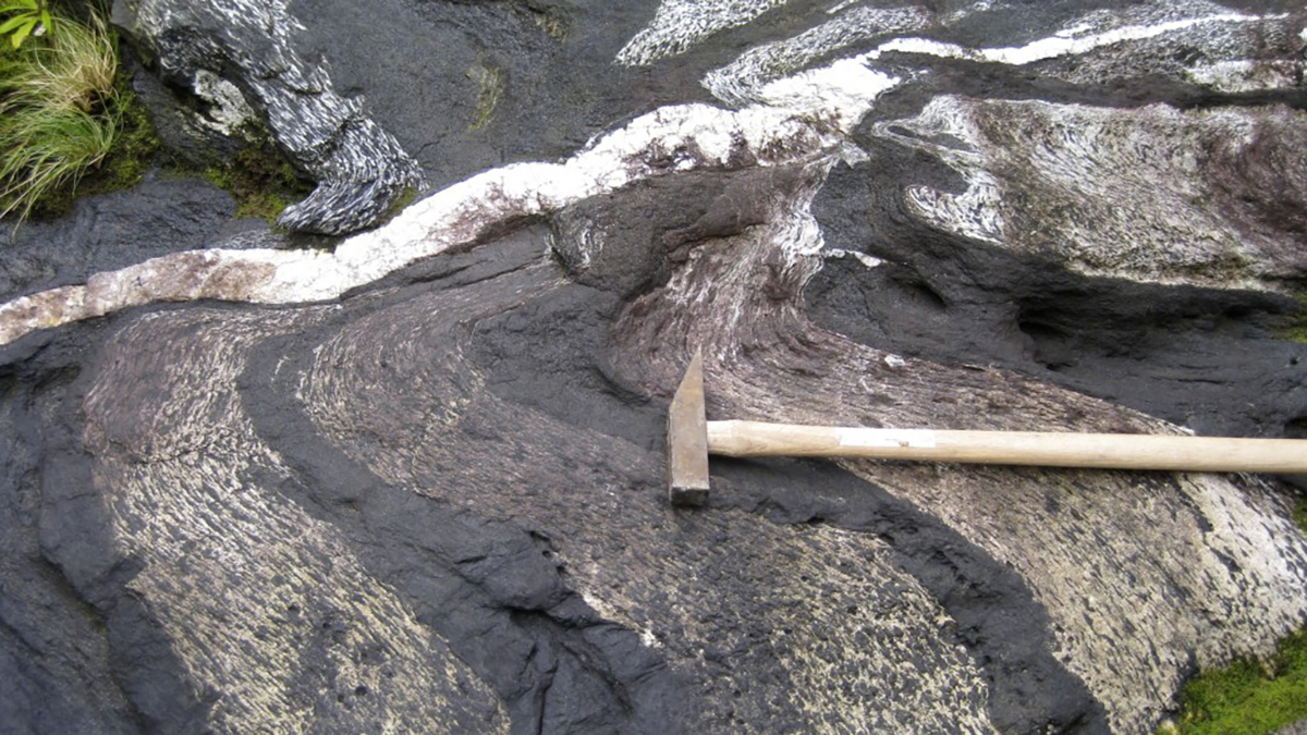 hammer sitting on rock formation
